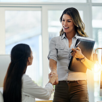 Image of woman shaking hands